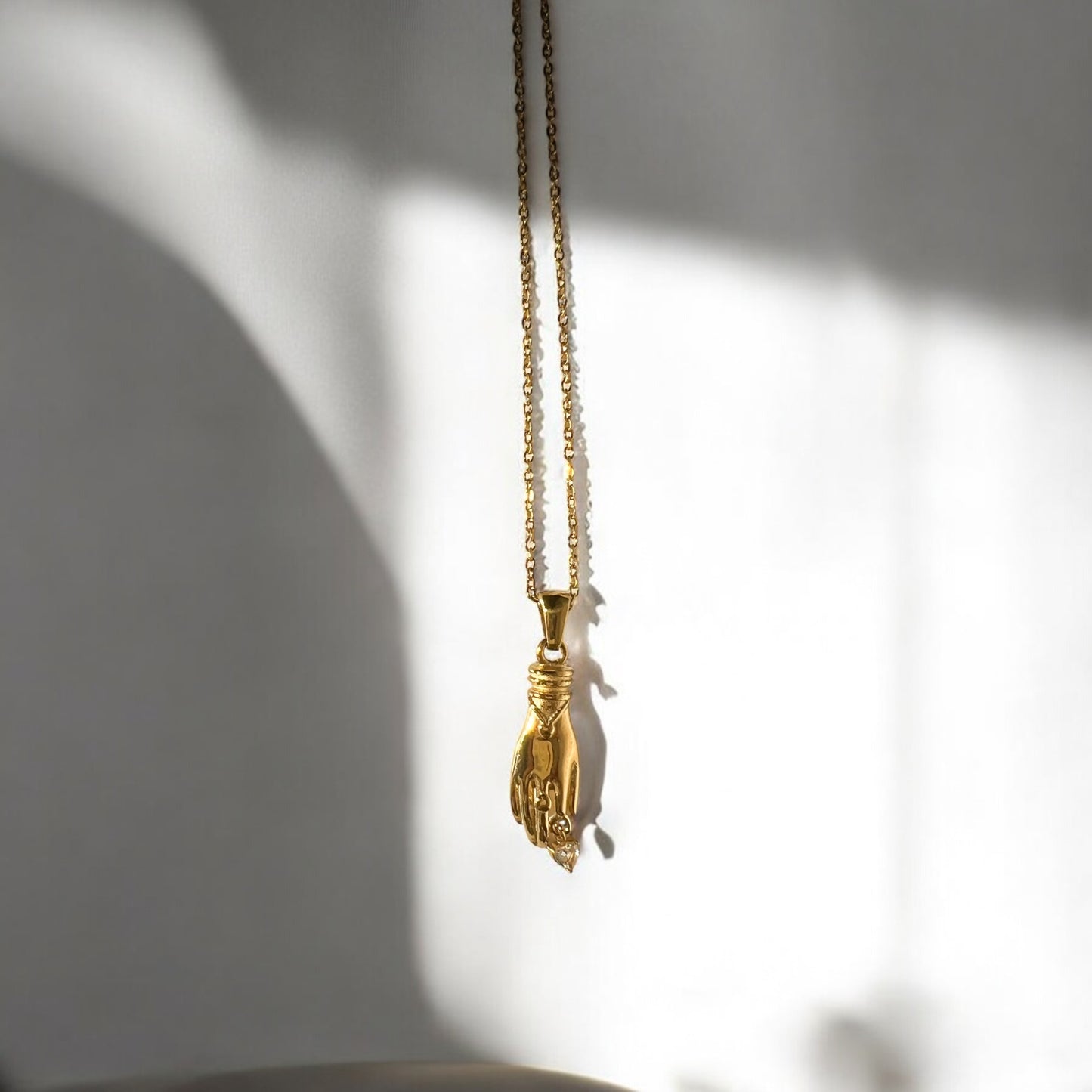 gold dainty hand necklace
