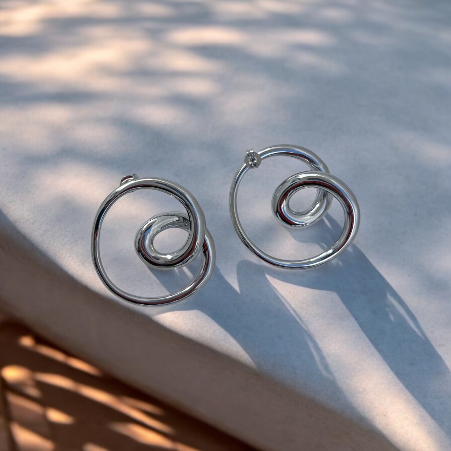 silver statement spiral earrings