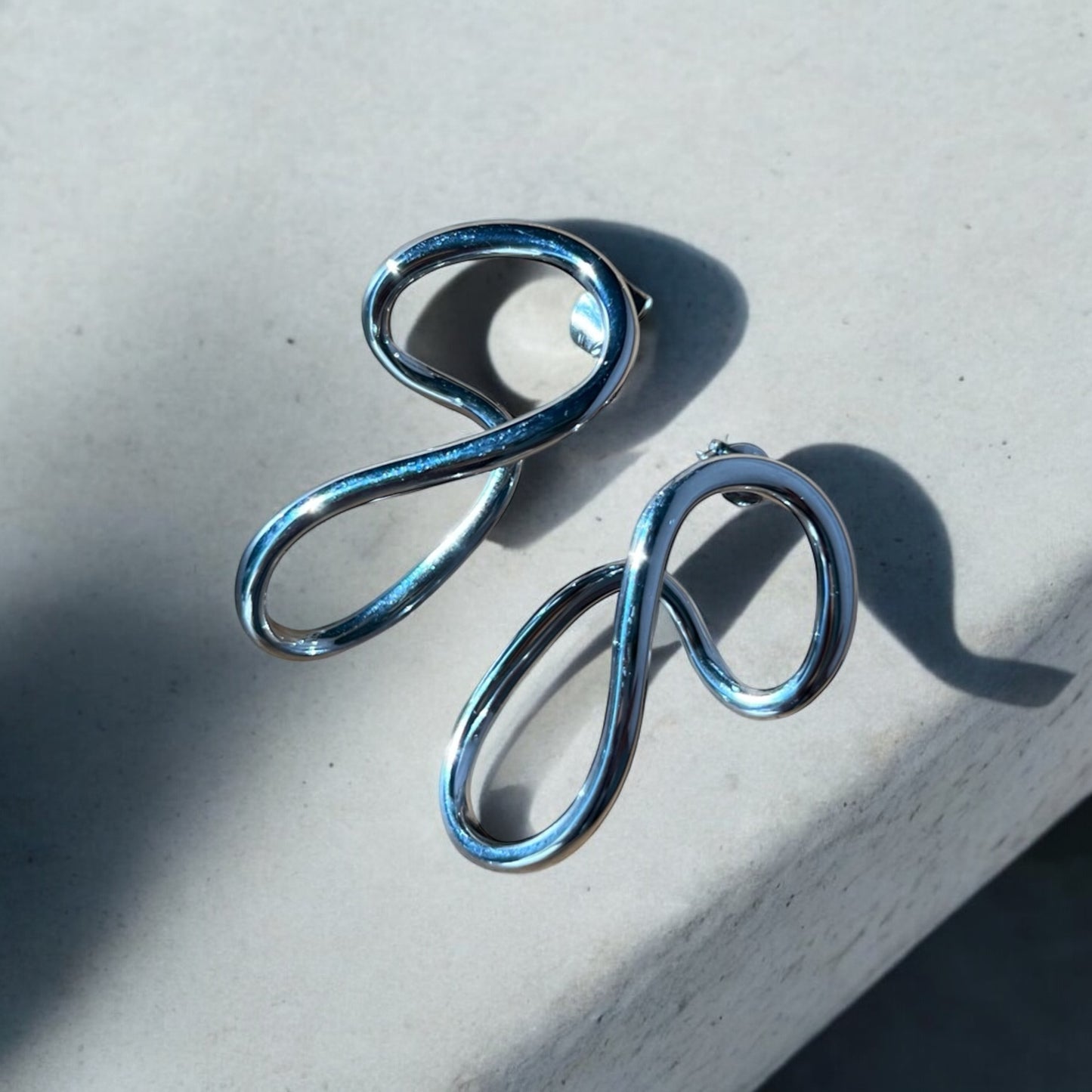 silver statement earrings