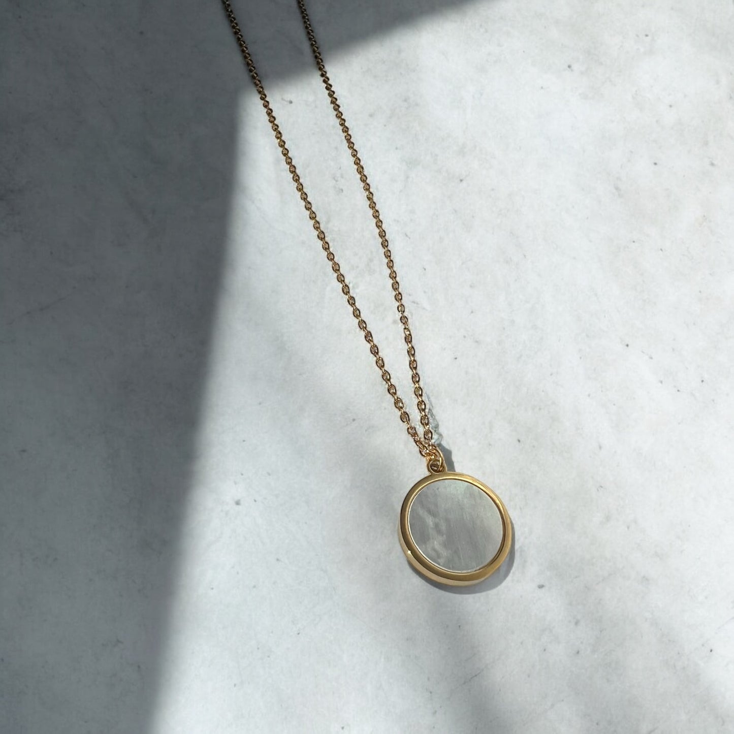 white round necklace