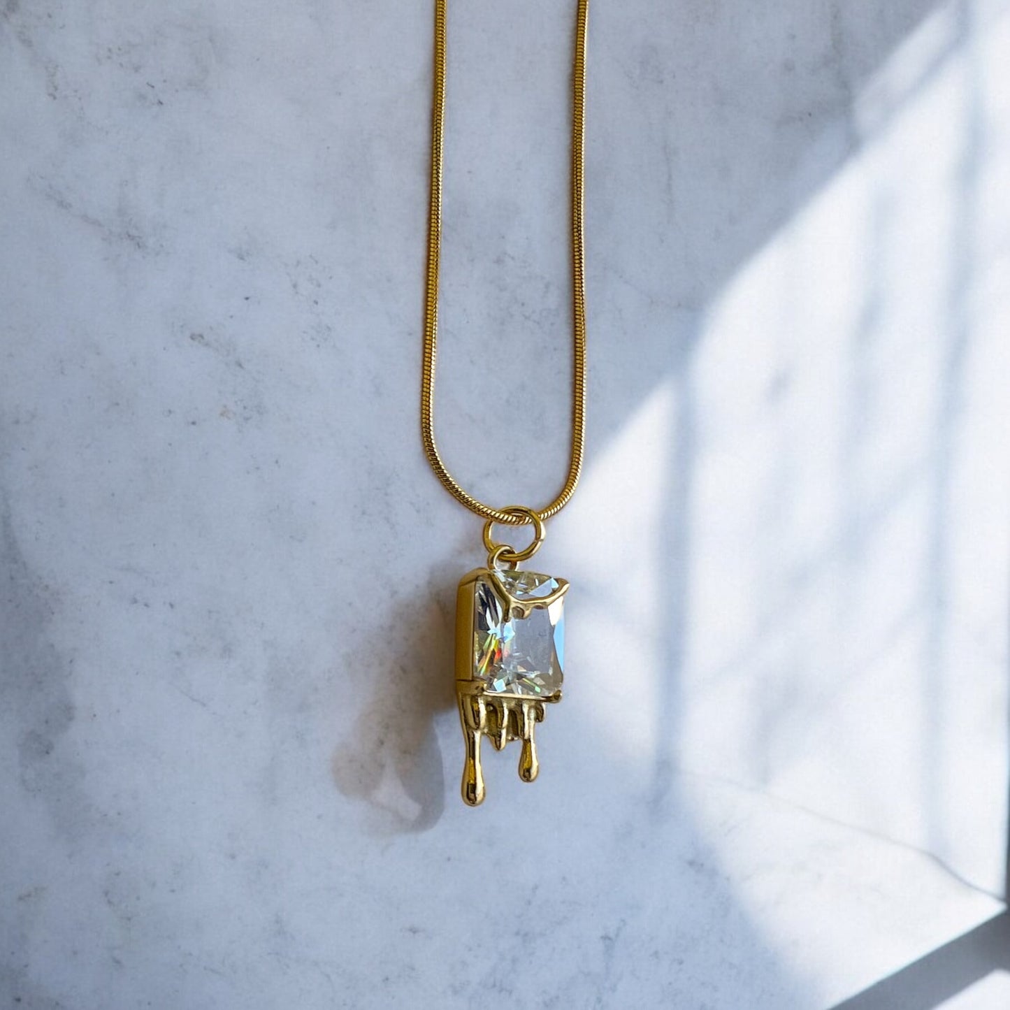melting gold pendant