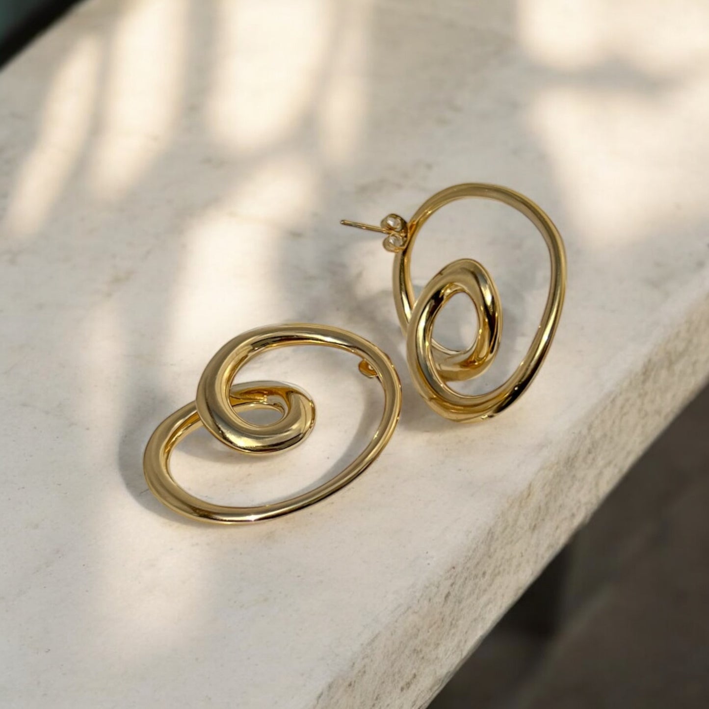 swirly earrings gold