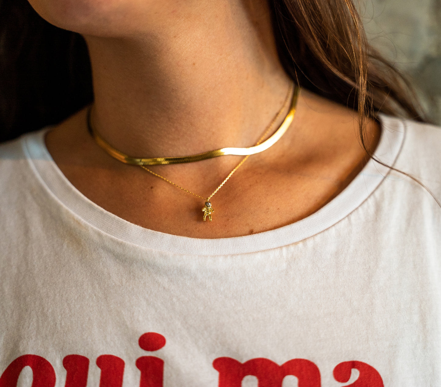 gold astronaut necklace