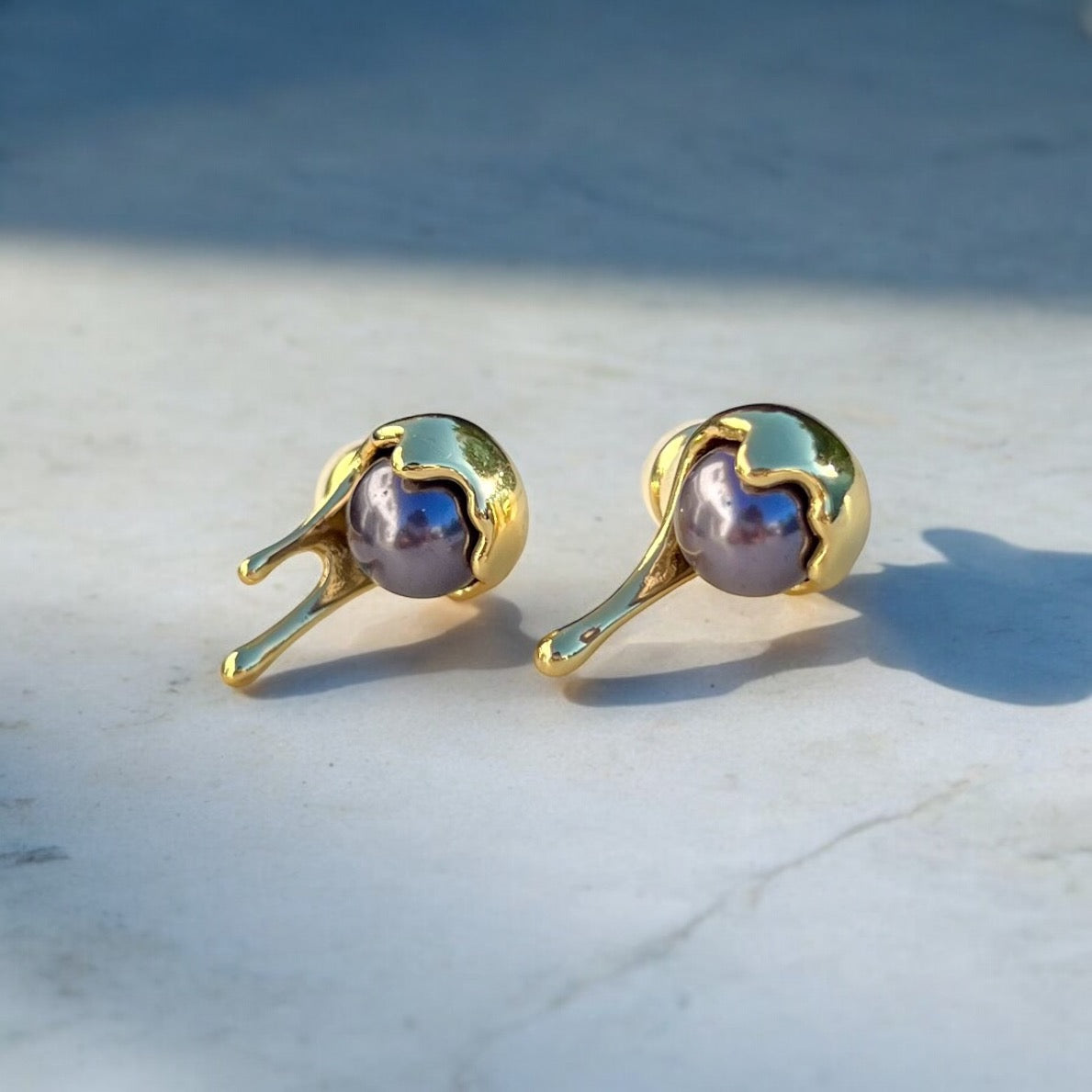 gold liquid black pearl earrings