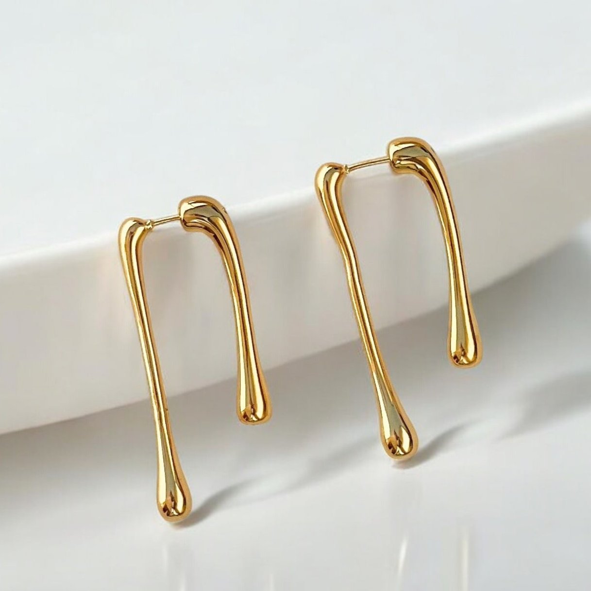 gold drip earrings